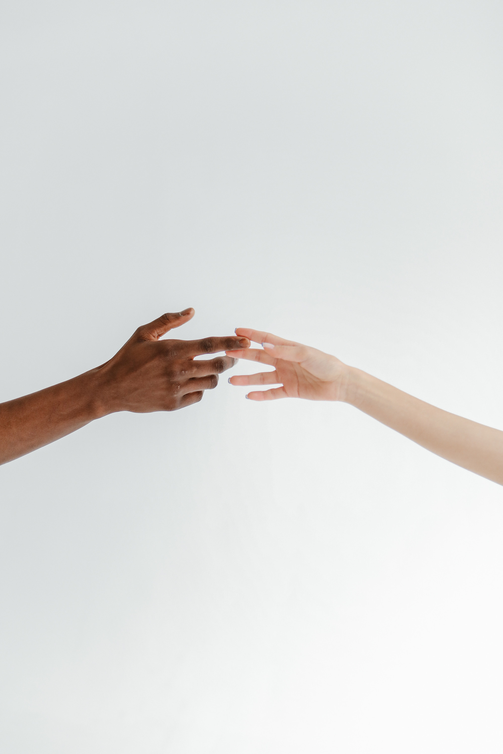 Hands of Man and Woman on White Background